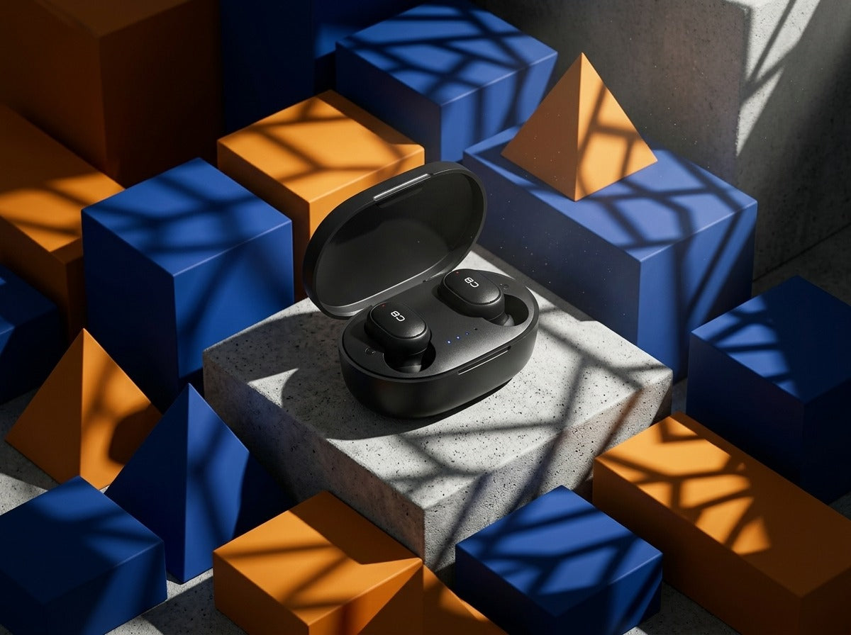CTRL8 A6S wireless earbuds in sleek black charging case displayed on a concrete block surrounded by geometric shapes and shadows.