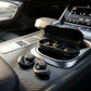 CTRL8 X29 open-ear headphones with charging case placed on a car console for seamless audio during travel