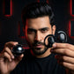User holding CTRL8 T2 over-the-ear earbuds with UNBLOQ technology against a black and red illuminated background